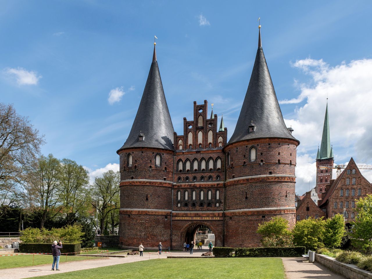 A daytime view of the iconic Holstentor gate in Lübeck, a UNESCO World Heritage Site.